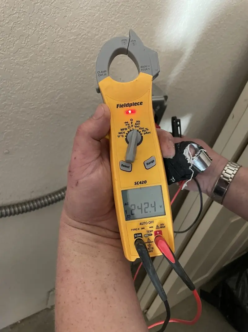 Voltage testing with clamp meter during Recessed Lighting Installation in Florence